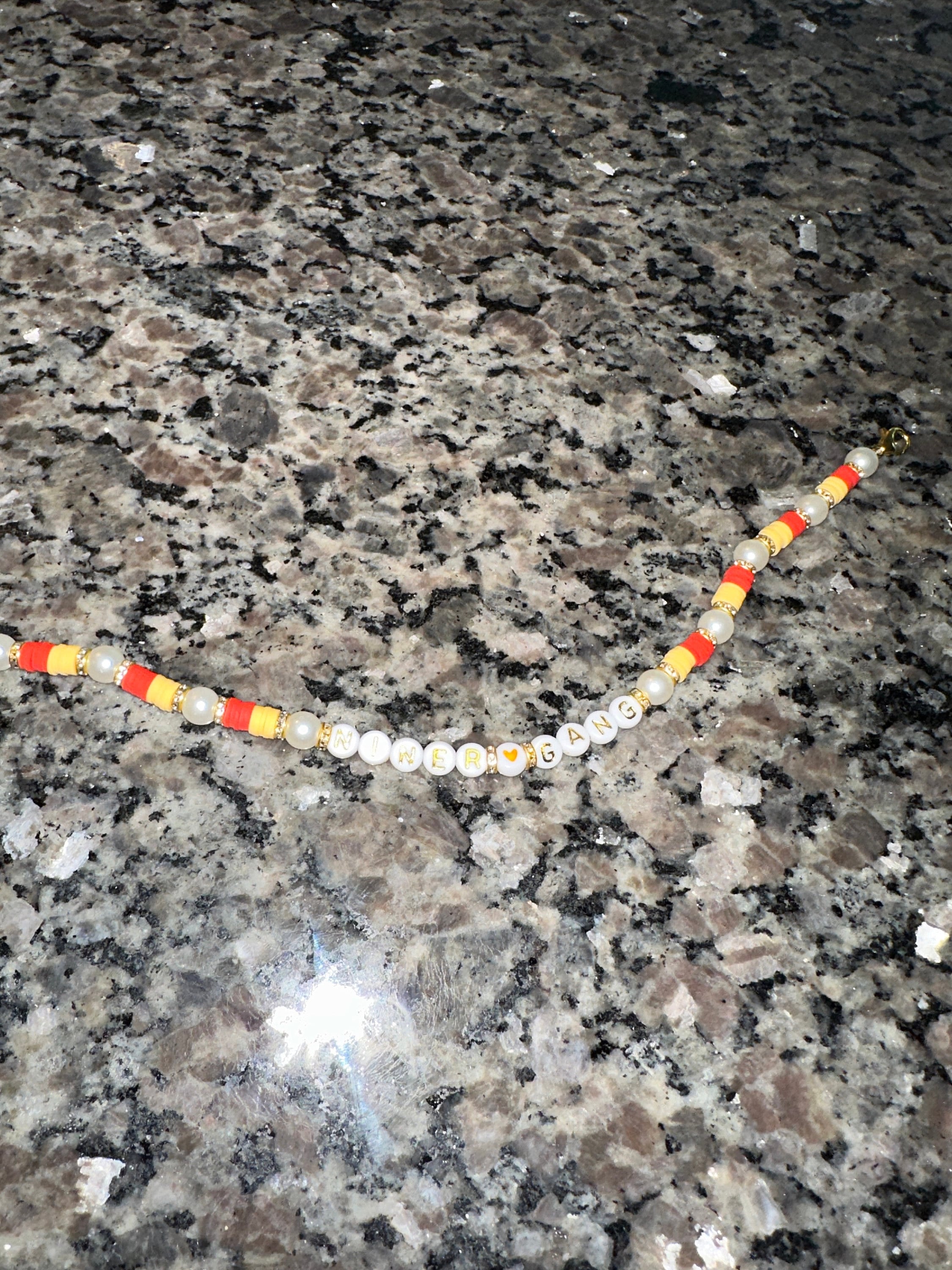 Beaded sports team saying trucker hat chain