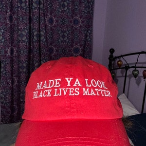 Grab everyone\'s attention for the realest cause! Trump spoof BLM red hat Amazon.com: Function - Made You Look Black Lives Matter Red  main image 3
