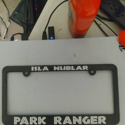 Glossy Black License Plate Frame - Isla Nublar Park Ranger Jurassic Park Fan Theme
