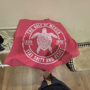 Laura added a photo of their purchase