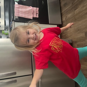 Sarah added a photo of their purchase