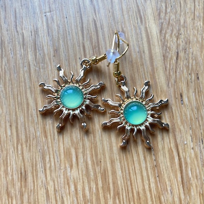 Glittery brown sun earrings