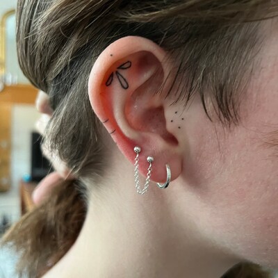 Two stud earrings connected by chain Clearance