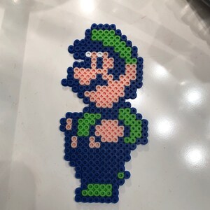 Just finished ironing Street Fighter Alpha 3 Ryu sprite in perler beads. :  r/beadsprites