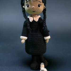 Unofficial Wednesday Crochet: Includes Everything You Need to Make Your Own Goth Amigurumi Character – Includes Three Colors of Yarn, Crochet Hook, Yarn Needle, Plastic Safety Eyes, Fiberfill Stuffing, Instruction Book [Book]