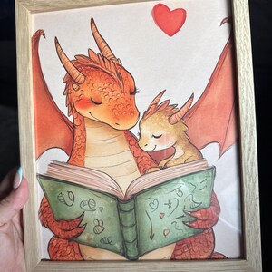 Baby Dragon Cuddling During Storytime Wall Art, Whimsical Nursery