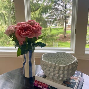 Elana added a photo of their purchase