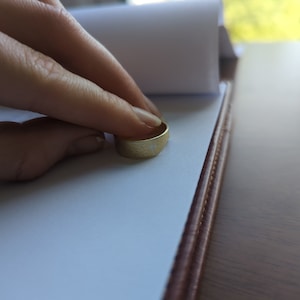 Customer photo from Grace, Textured Yellow Gold Band 7mm