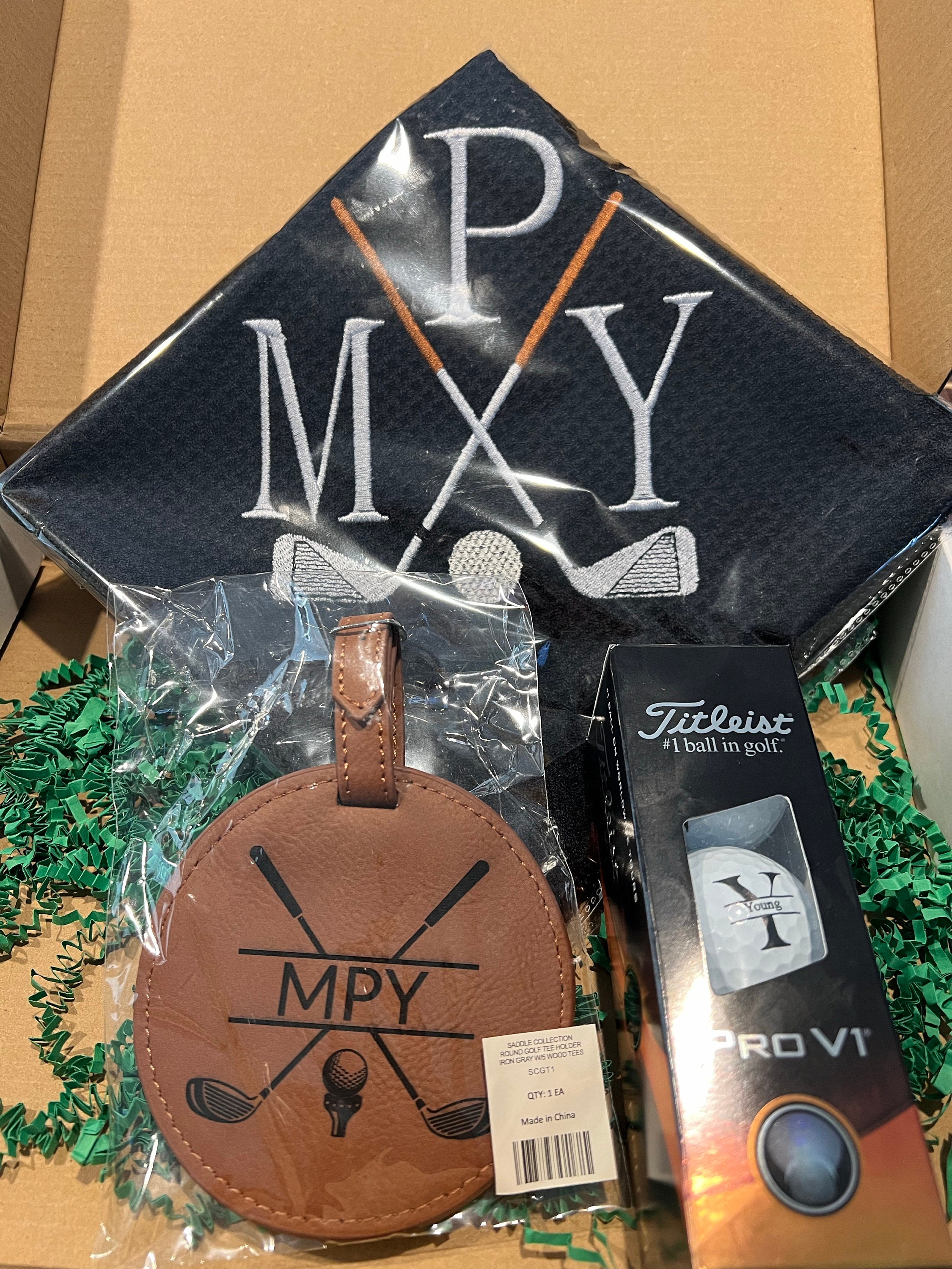 Personalized Golf Gift Box. Include a golf towel, a set of three golf Pro V1 balls with monograms, and a golf bag tag with tee holder