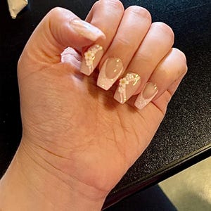 Nicki added a photo of their purchase