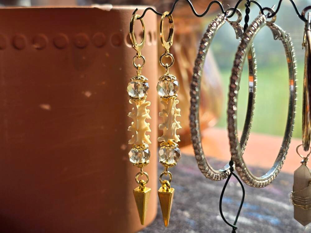 Exquisite Victorian-Era Inspired Coiled Rattlesnake Vertebrae Dangling, Earrings with Intricate Metalwork and Antique Brass Finish