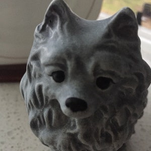 pomeranian statue with wings