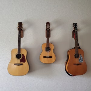 CAHAYA Support mural pour guitare avec crochet réglable en forme de U avec  5 médiators et 1 sac de sélection pour basse électrique acoustique Banjo  Ukulélé Mandoline CY0297 : : Instruments de