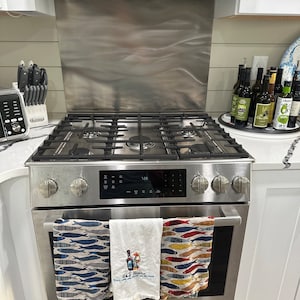Currents Stainless Steel Kitchen Backsplash 30 x 48 - Beautiful, all  stainless steel range backsplash with an engraved Currents pattern.  Available