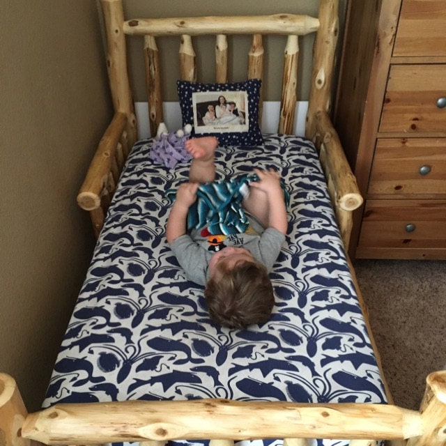 Log baby bed top
