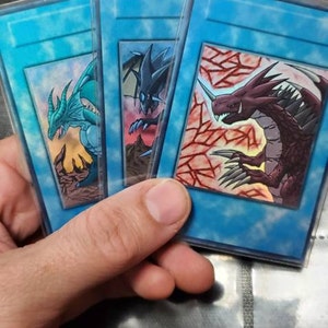 yugioh 3 legendary dragons cards Legend of Heart DLCS-EN008 Yu-Gi-Oh! Card 2350 An unworthy dragon with three sharp horns sprouting from its head. Hot take, I prefer the
