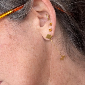 Customer photo, Cow Abduction Stud Earrings