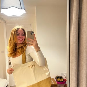 Sarah added a photo of their purchase