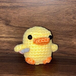 duck plushie with knife