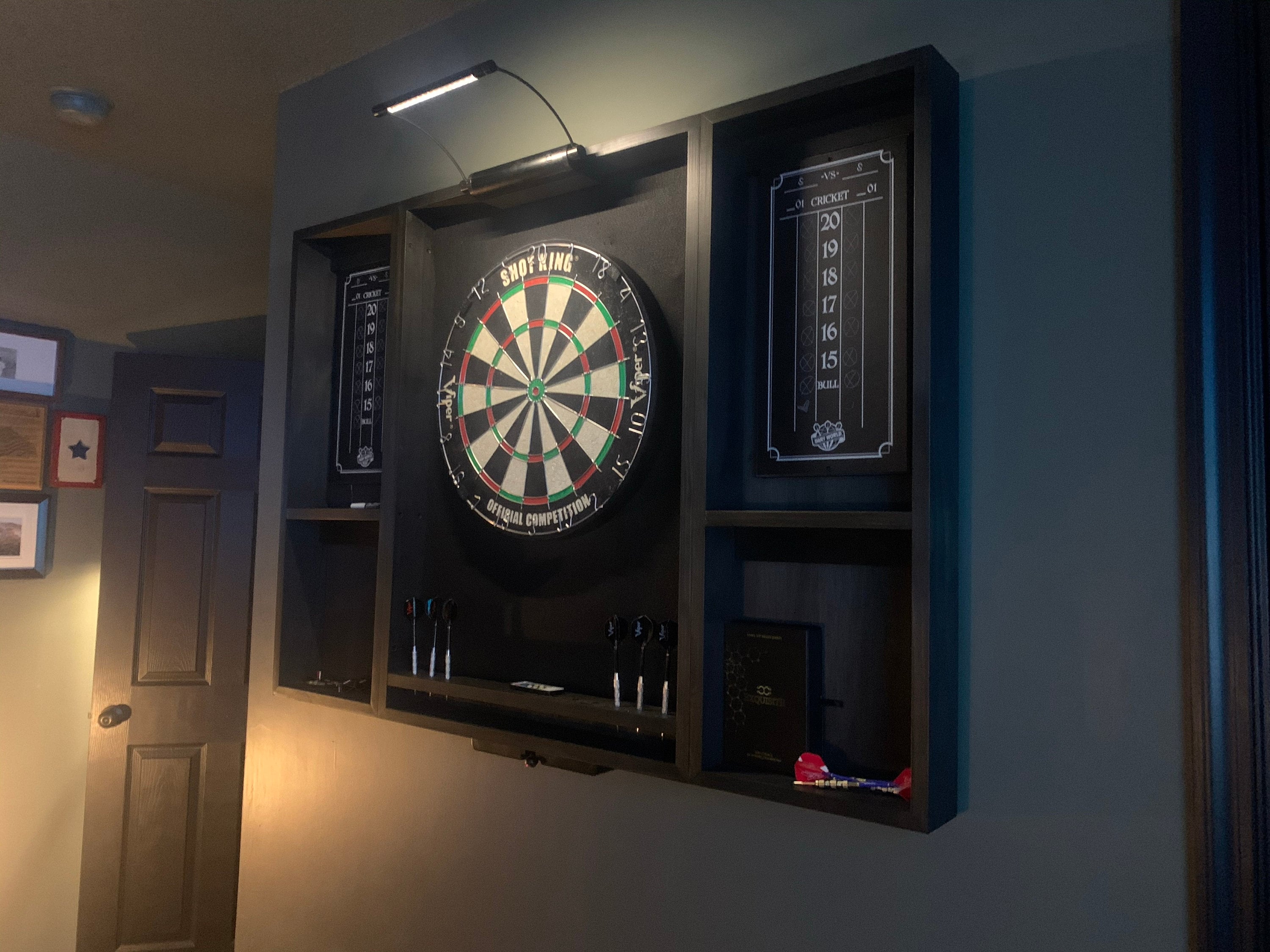 Makes a great fathers day gift  Our best selling Black dartboard cabinet with a Dartboard, darts, led light. and 2 scoreboards.