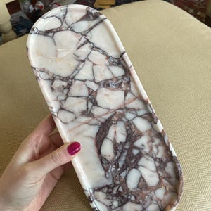 Caitlin added a photo of their purchase