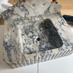gia added a photo of their purchase