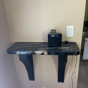 Carolyn added a photo of their purchase