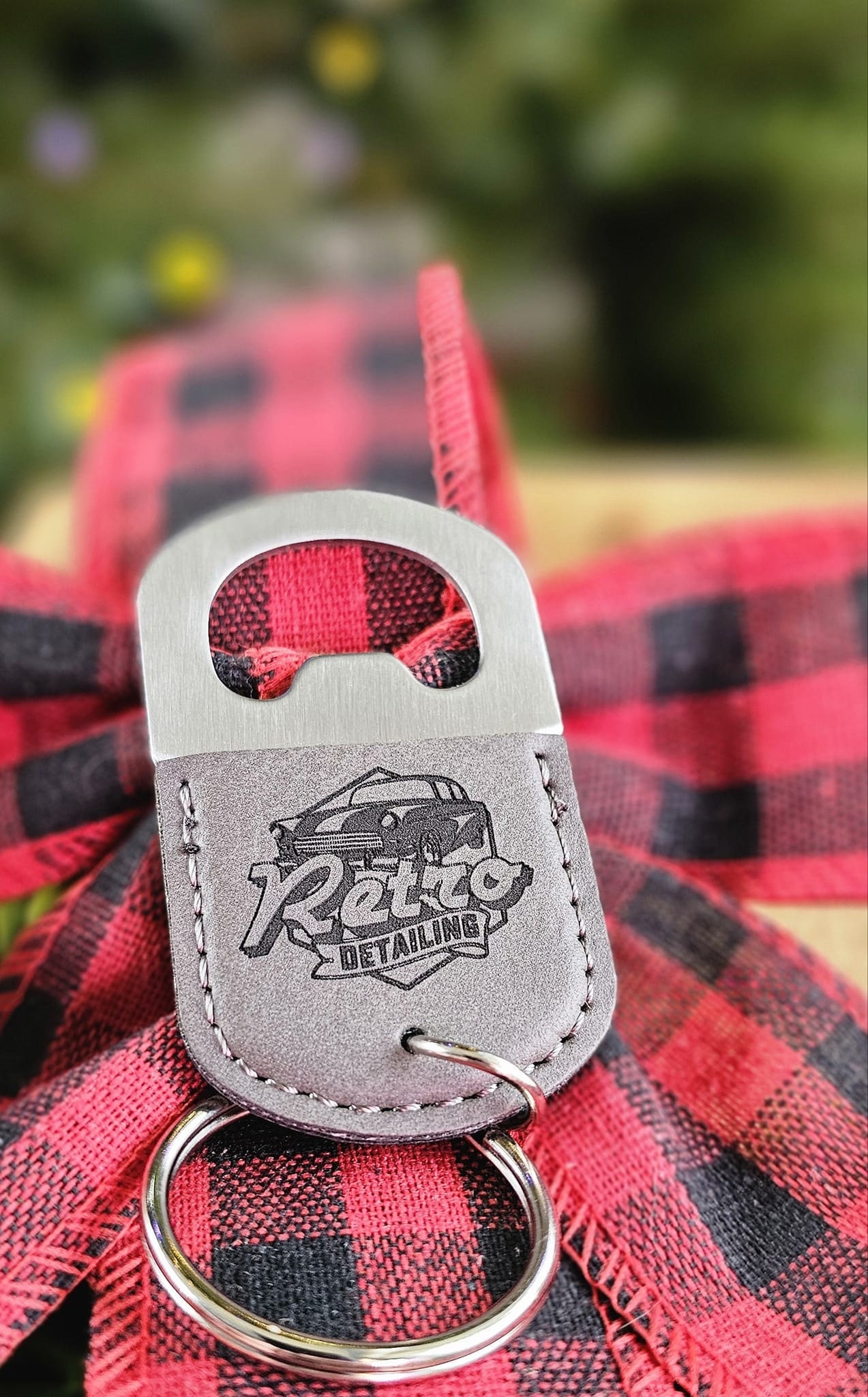 Customer photo of Custom Logo Engraved / Etched Leatherette and Metal Keychain Bottle Opener from Dusty