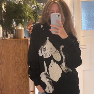 Sasha added a photo of their purchase