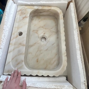 Charlotte added a photo of their purchase