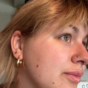 Customer photo from Shannon, Raw Garnet Stud Earrings in Yellow Gold
