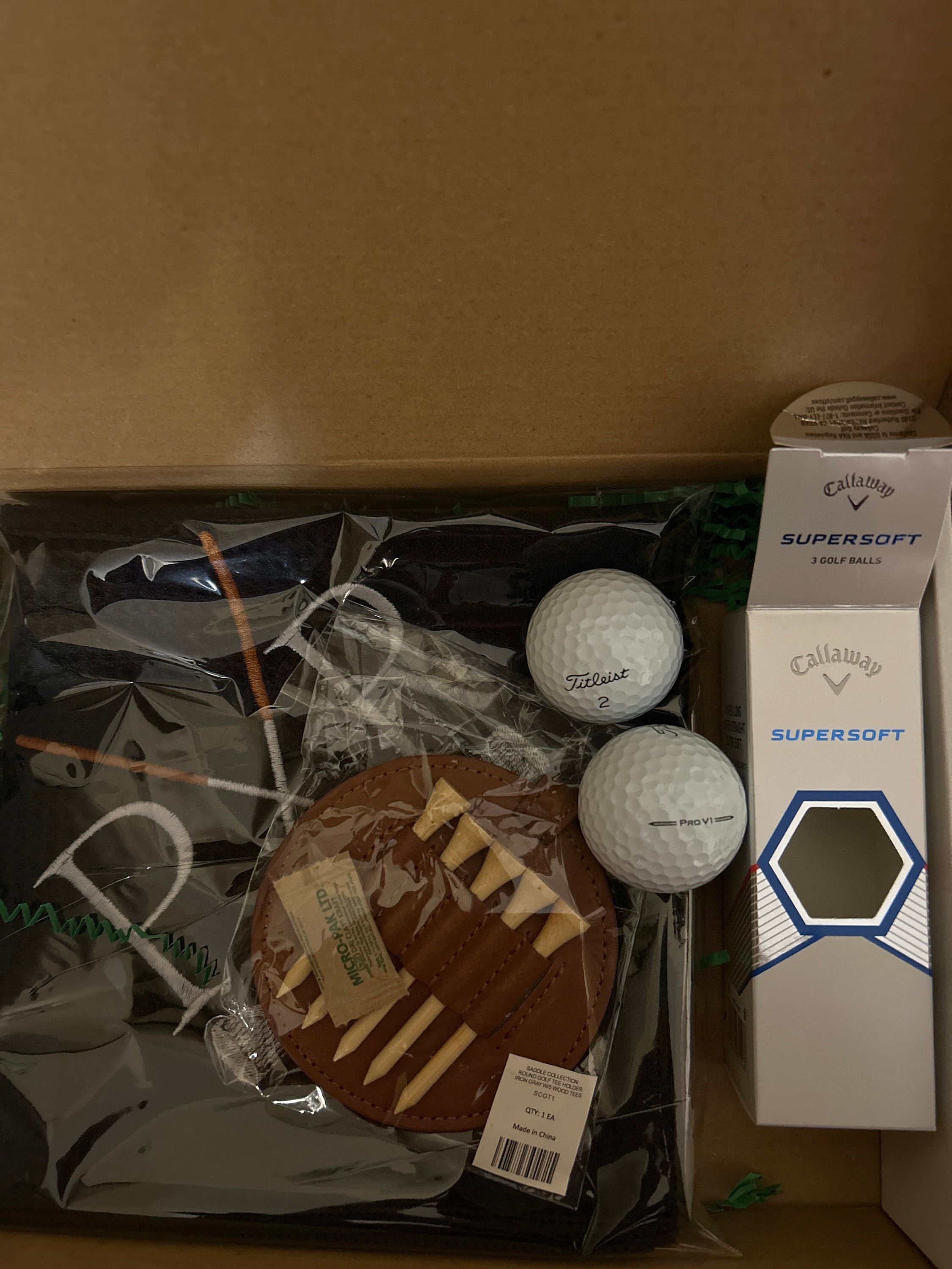 Personalized Golf Gift Box. Include a golf towel, a set of three golf Pro V1 balls with monograms, and a golf bag tag with tee holder