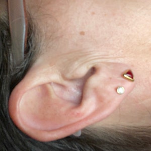 Customer photo from Jennifer, Dainty Red Triangle Garnet Stud Earrings