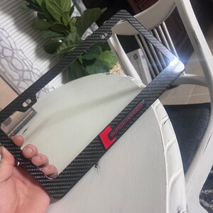 Black Stainless License Plate Frame Black TRD-Style 3D Emblem License Plate Frame – Stainless Steel, Rust-Free, 1-Year Warranty Trd Plate Frame - Foto 10