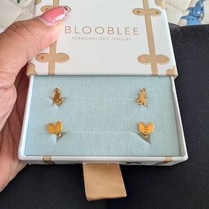 Customer photo, T-Rex Fossil Stud Earrings