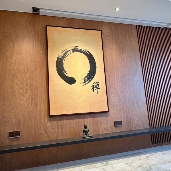 Adrian's Zen Enso Circle Canvas Print, Japanese Calligraphy Wall Art canvas print in their home — Antarmada