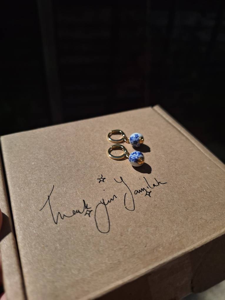 Blue & White Floral Ceramic Bead Charm Huggie Hoops, Choose 18K Gold Plated or Silver Plated, Handmade Hoop Earrings by Detail London.
