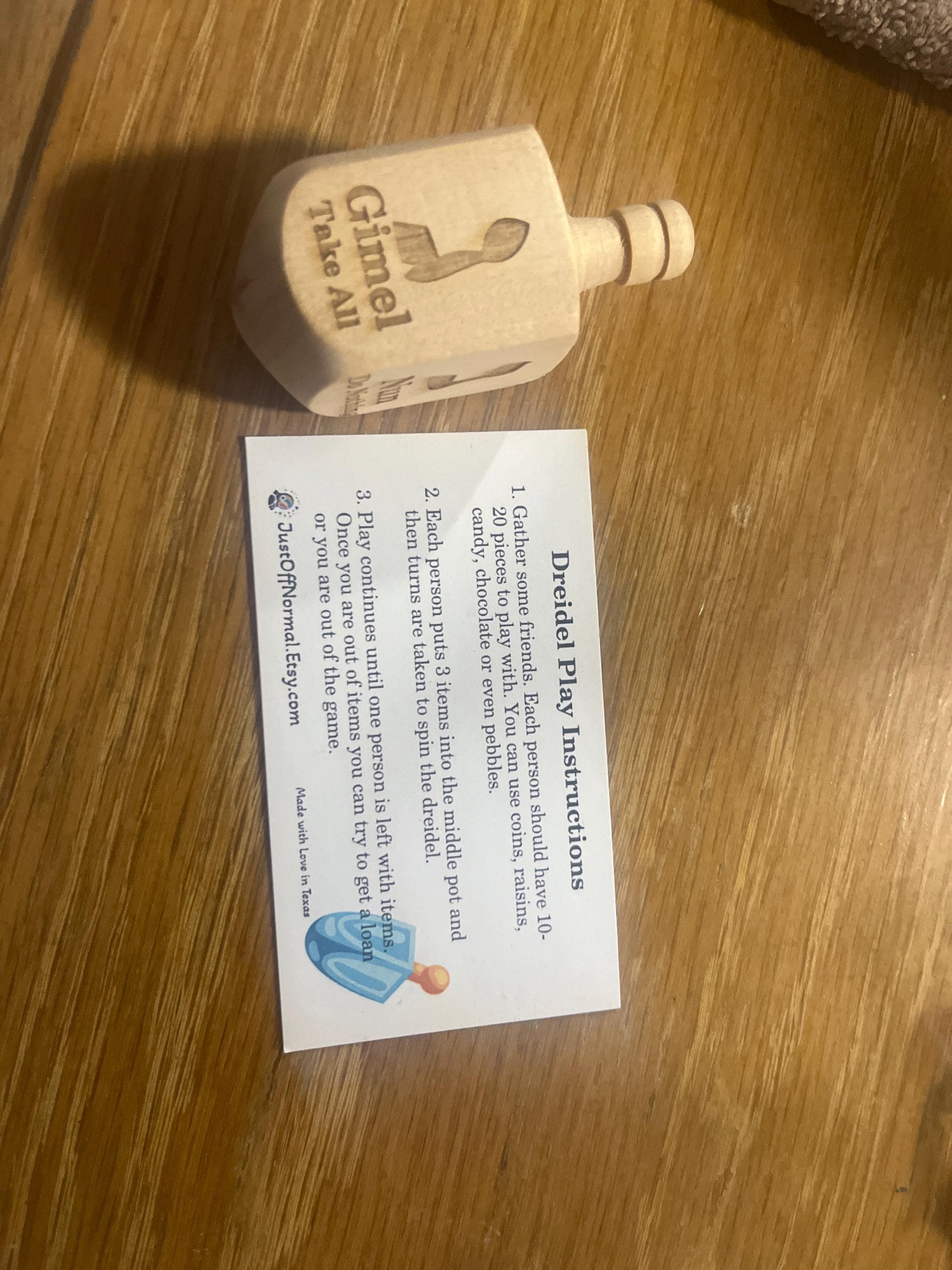 Wooden Dreidel Engraved with Hebrew and English Instructions