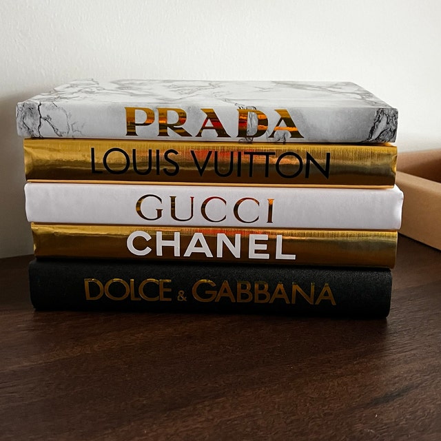 chanel louis vuitton gucci book stack