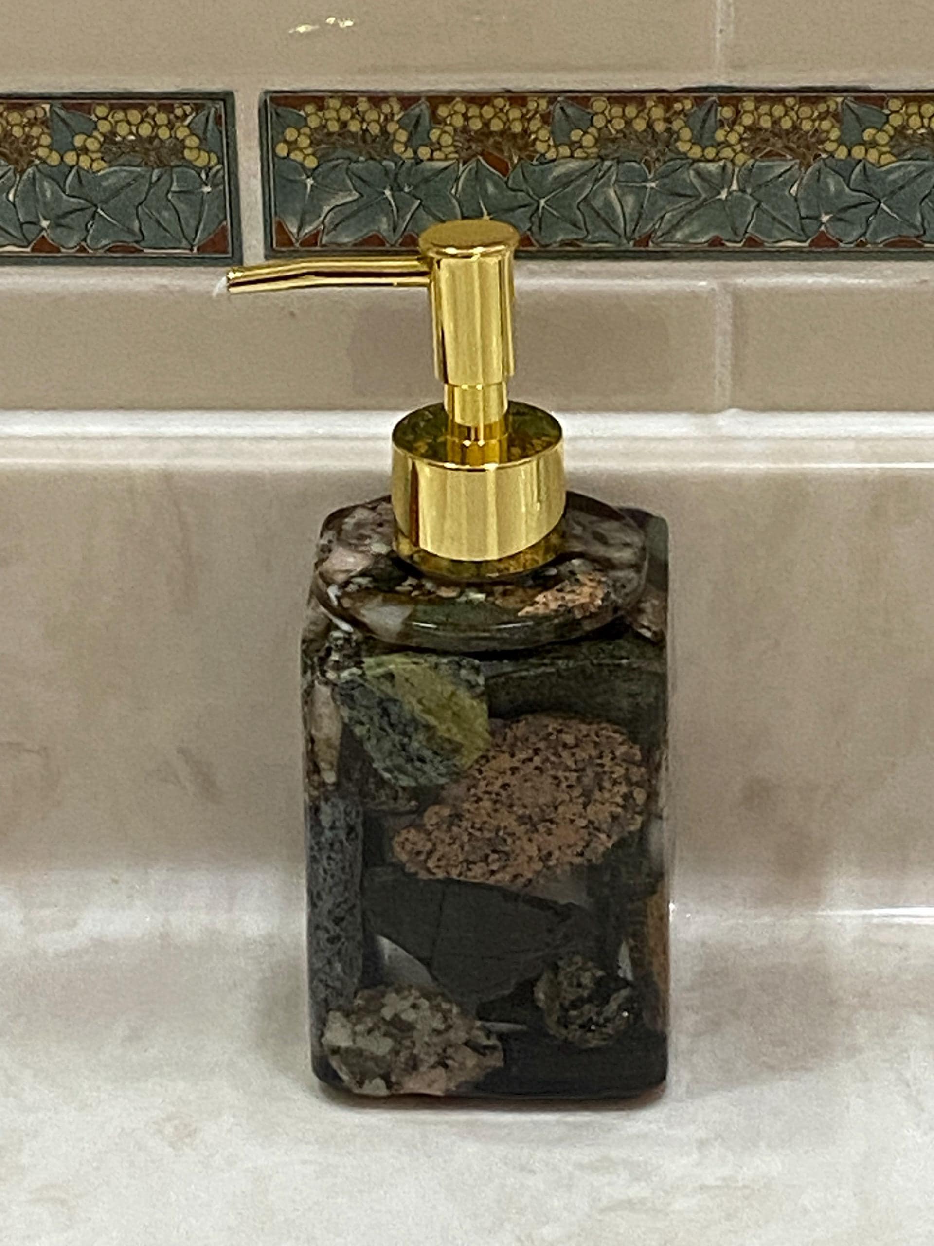 Hand crafted from Start to finish. Wicked elegant liquid soap dispenser!  Made with cut Maine Rocks!  Exquisitely unique