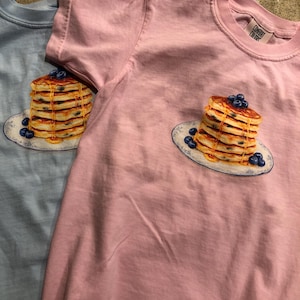 Tana added a photo of their purchase