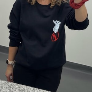 Tatiana added a photo of their purchase