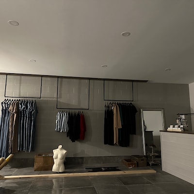 Minimalistic Clothes Rack Garment Rail Made of Metal Mounted on the ...