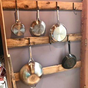 Cast Iron pot and pan storage on kitchen wall. : r/OrganizationPorn