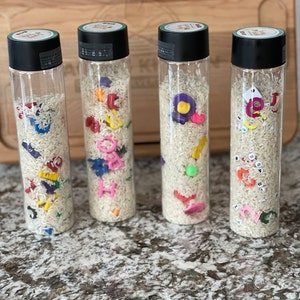 I Spy Sensory Bottle Rainbow Rice Sensory I Spy Bottle With Activity ...