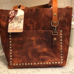Sheryl added a photo of their purchase