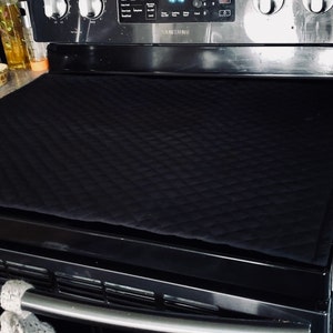 Quilted glass top stove cover. Never thought of this before, but would be a  pretty good way to protect the to…
