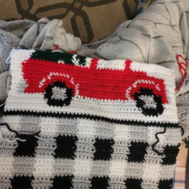 A customer's finished Red Christmas Truck Table Runner Crochet Pattern + Video