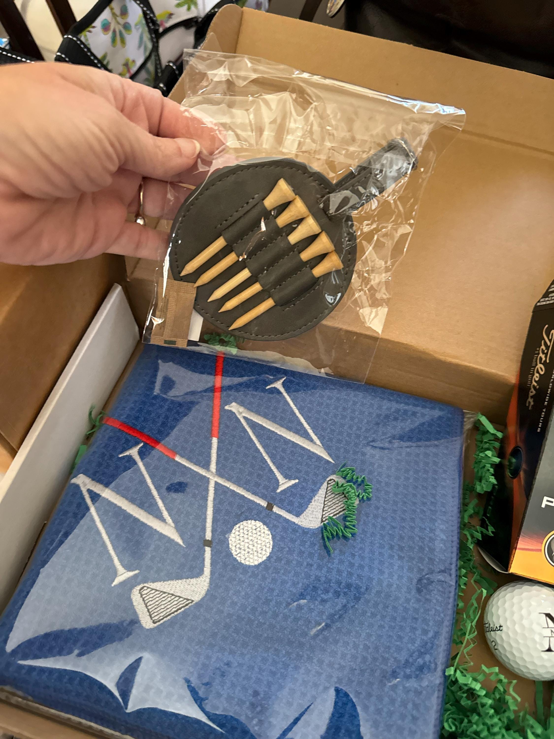 Personalized Golf Gift Box. Include a golf towel, a set of three golf Pro V1 balls with monograms, and a golf bag tag with tee holder