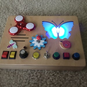 mazes busy box original birthday present for toddler with lantern Activity board zipper switches abacus bell and buckles. locks
